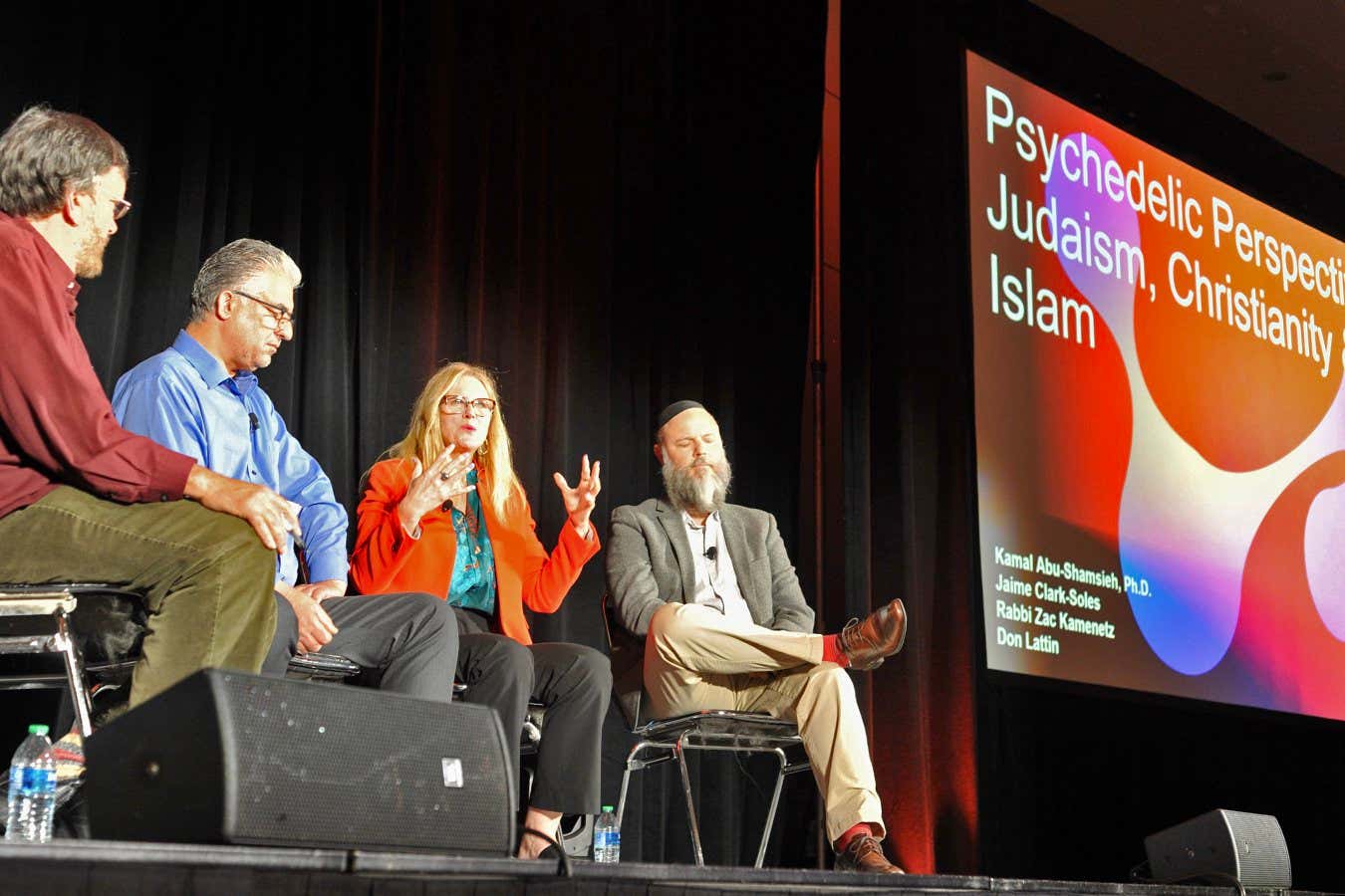 Kamal Abu-Shamsieh, PhD - Muslim: https://www.gtu.edu/faculty/kamal-abu-shamsieh Jaime Clark-Soles - Christian Baptist Rabbi Zac Kamenetz - Jewish, founded Shefa: https://www.shefaflow.org Don Lattin - moderator: https://en.m.wikipedia.org/wiki/Don_Lattin A panel discussion at Psychedelic Science 2023, a conference held in Denver, Colorado in June 2023