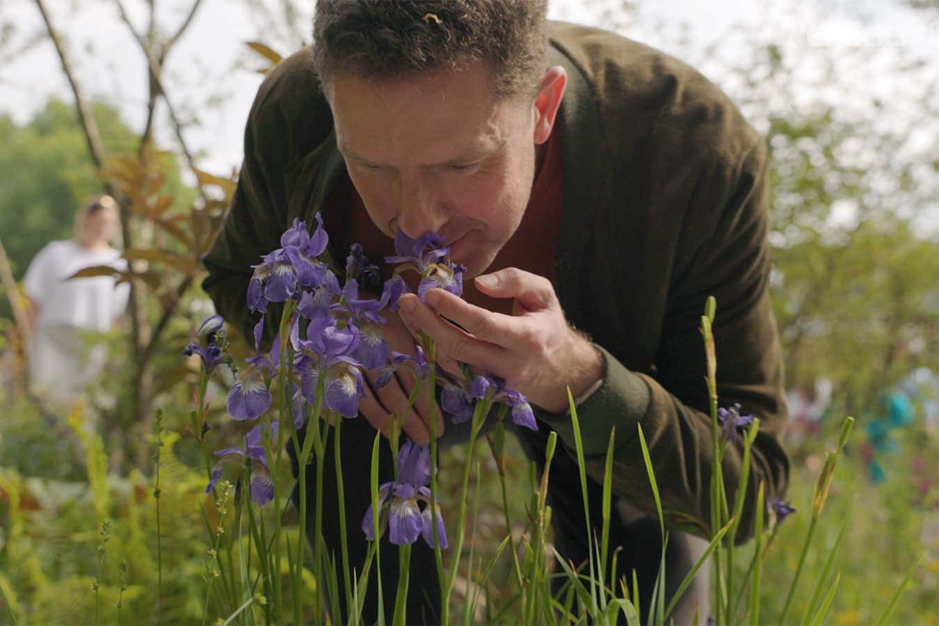 New Scientist reporter David Robson smells flowers at Chelsea Flower Show in london